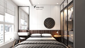 A modern hotel room with a large bed, a desk, and a wardrobe. - Saigon Royal Tower! (Ho Chi Minh)