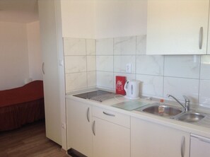 Fridge, dishwasher, espresso maker, cookware/dishes/utensils