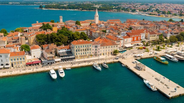 An aerial view of a coastal town with historic buildings, a prominent church tower, and a marina with boats. - Apartment in Poreč with Terrace, WIFI (819-3) (Porec)