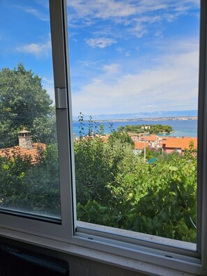 Guests can enjoy a serene view of the body of water from the comfort of their room.