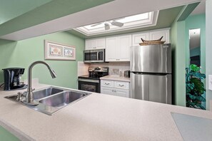 Fridge, microwave, oven, stovetop - Waterfront Dock View 2 bed, 2 bath at Sanibel Moorings #1632 (Sanibel)