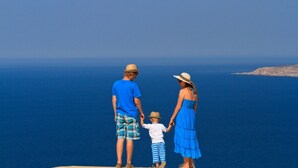 A family of three standing on a cliff overlooking a vast ocean. - Apartment in Medulin with Terrace, Air condition, WIFI, Washing machine (64-3) (Medulin)