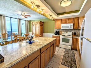 Enjoy cooking in this well-equipped kitchen with a large island and modern appliances.