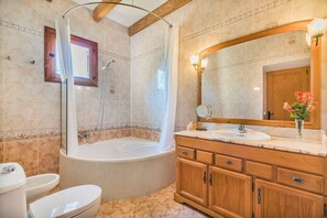 Bathtub, hair dryer, towels