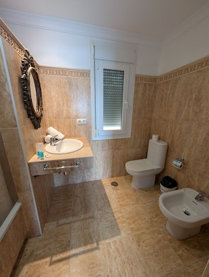 Bathtub, hair dryer, towels