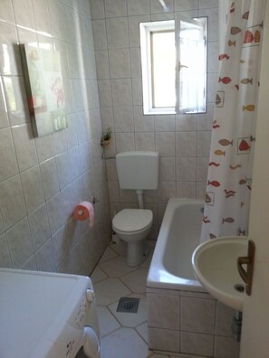 Bathtub, hair dryer, towels