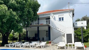 A two-story house with a balcony and a swimming pool. - Apartment in Bibinje with Terrace, Air condition, WIFI, Washing machine (877-3) (Bibinje)