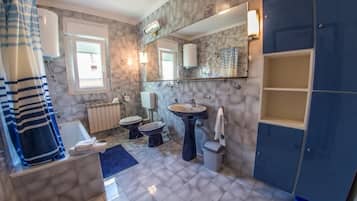 Bathtub, hair dryer, towels