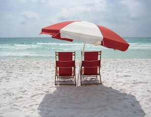 Relax under the shade of our beach umbrellas, surrounded by comfortable beach chairs and the soothing sound of the ocean.