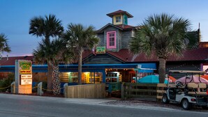 A seafood restaurant with a colorful exterior and a golf cart parked outside. - Two Balconies, Walk to the Beach, Pool, Beach Service, Remodeled Bathrooms (Miramar Beach)