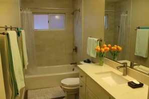 Bathtub, hair dryer, towels