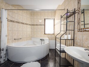 Bathtub, hair dryer, towels