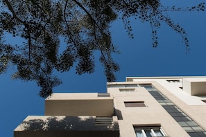 A modern building with a flat facade and rectangular windows.
