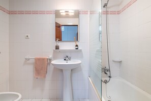 Bathtub, hair dryer, towels