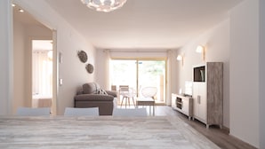 Een moderne woonkamer met een marmeren eettafel, een bank en een tv-meubel.