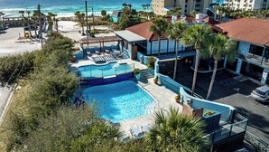 A hotel with a swimming pool, beach view, and multiple buildings. - 2 Queen Beds. Don`t Leave Your Dog at Home! (Destin)