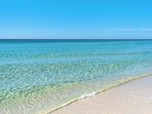 A beach with clear turquoise water and a sandy shore. - Gulf and Pool Views, Free Seasonal Beach Service, Designated Beach Area on 30A!! (Santa Rosa Beach)