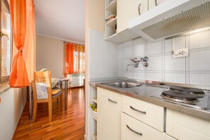 Fridge, coffee/tea maker, cookware/dishes/utensils