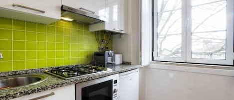 Fridge, microwave, stovetop, coffee/tea maker