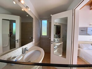 Bathtub, hair dryer, towels