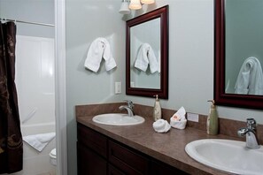 Combined shower/tub, hair dryer, towels, soap