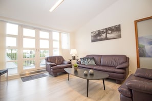 Apartment, 4 Bedrooms, Sea View | Living area | Flat-screen TV