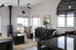 Cabin, 3 Bedrooms, Ocean View | Living area | Fireplace, iPod dock - Cabin by the Sea (Grindavik)