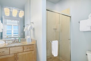 Combined shower/bathtub, hair dryer, towels, soap
