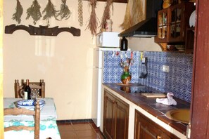 Fridge, microwave, coffee/tea maker, cookware/dishes/utensils