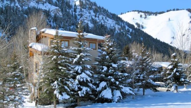 A snow-covered mountain with a building surrounded by trees. - Great 2 bed condo, Private deck & hot tub.  Best location in Ketchum! (Ketchum)