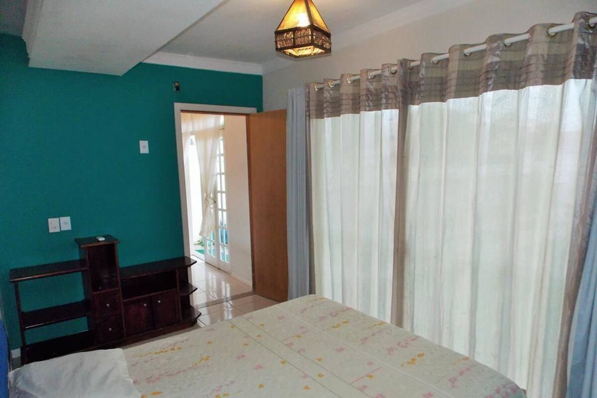 House (2) | Desk, laptop workspace, blackout drapes, iron/ironing board