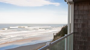 A beachfront property with a balcony overlooking the ocean. - Promo! Oceanfront Condo w/ Private Hot Tub, Indoor Pool, WiFi and More! (Lincoln City)