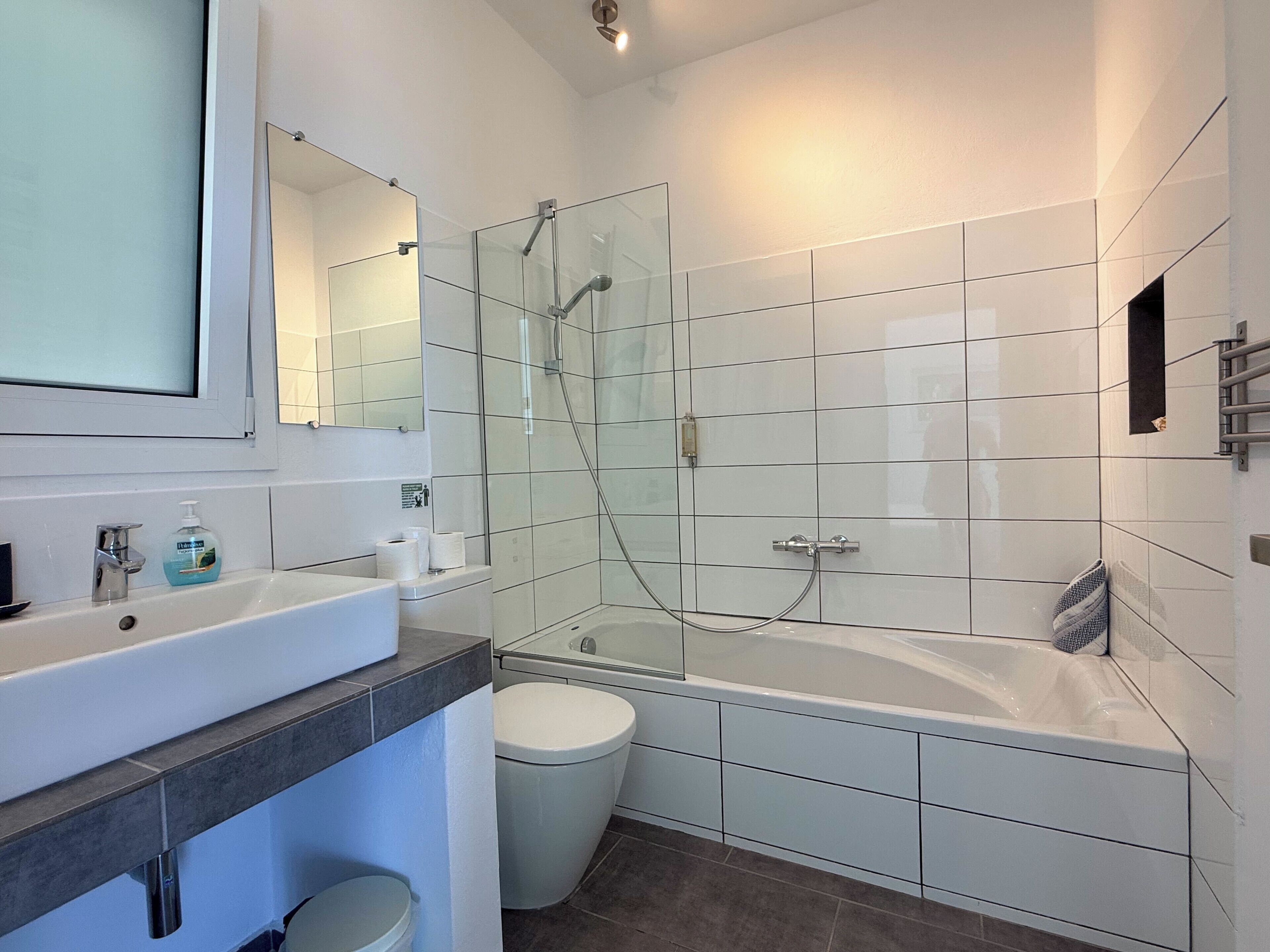 Bathtub, hair dryer, towels