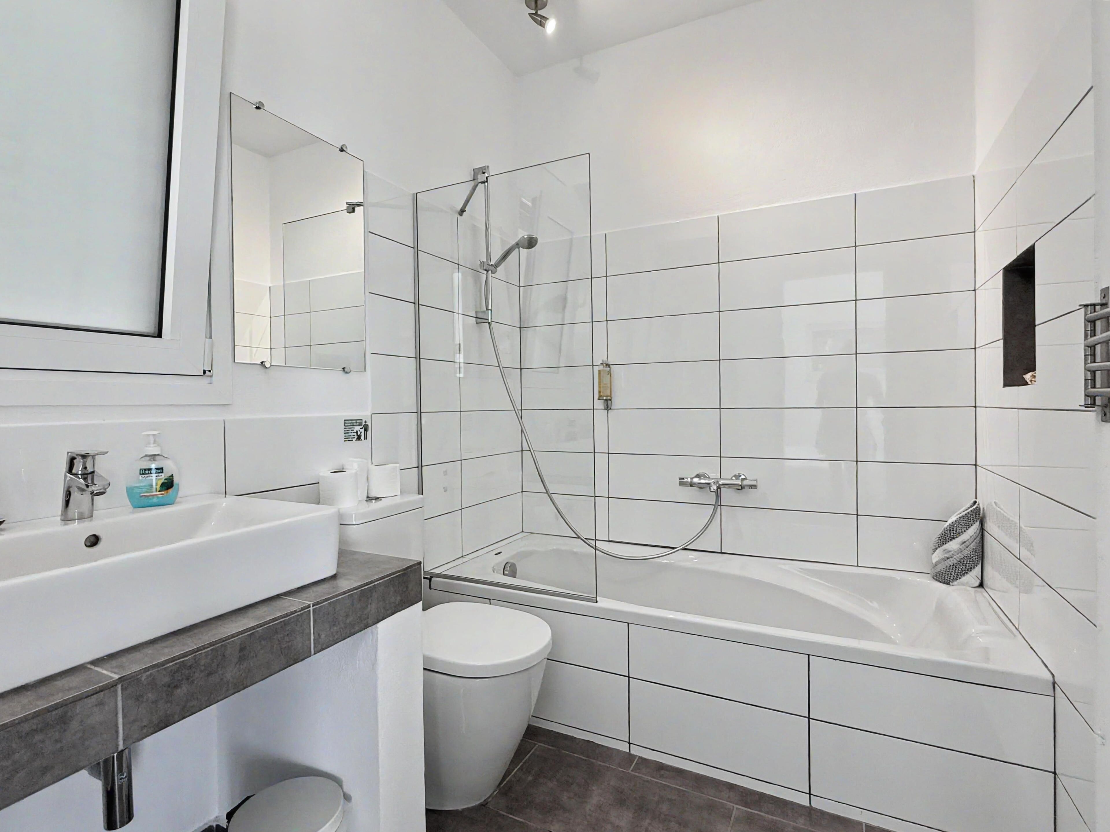 Bathtub, hair dryer, towels