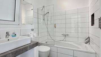 Bathtub, hair dryer, towels