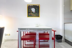 Enjoy meals in this cozy dining area with a stylish table and comfortable chairs.