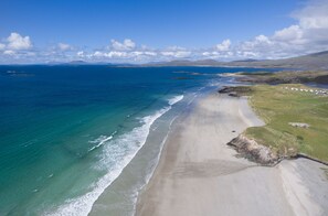A coastal landscape with a sandy beach, clear blue waters, and distant hills. - Cottage 339 - Renvyle - sleeps 9 guests in 4 bedrooms (Unknown)