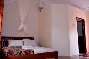 Deluxe Double Room | Individually decorated, individually furnished, blackout drapes - Sadrina Comfort Cottages (Kampala)
