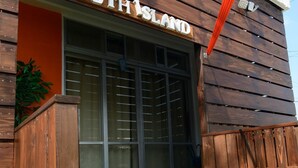 A wooden building with a sign reading "SOUTH ISLAND". - South Island (Itoman)