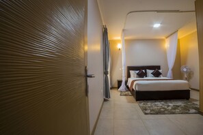 Laptop workspace, iron/ironing board, free WiFi, bed sheets - Natra Apartments (Kampala)