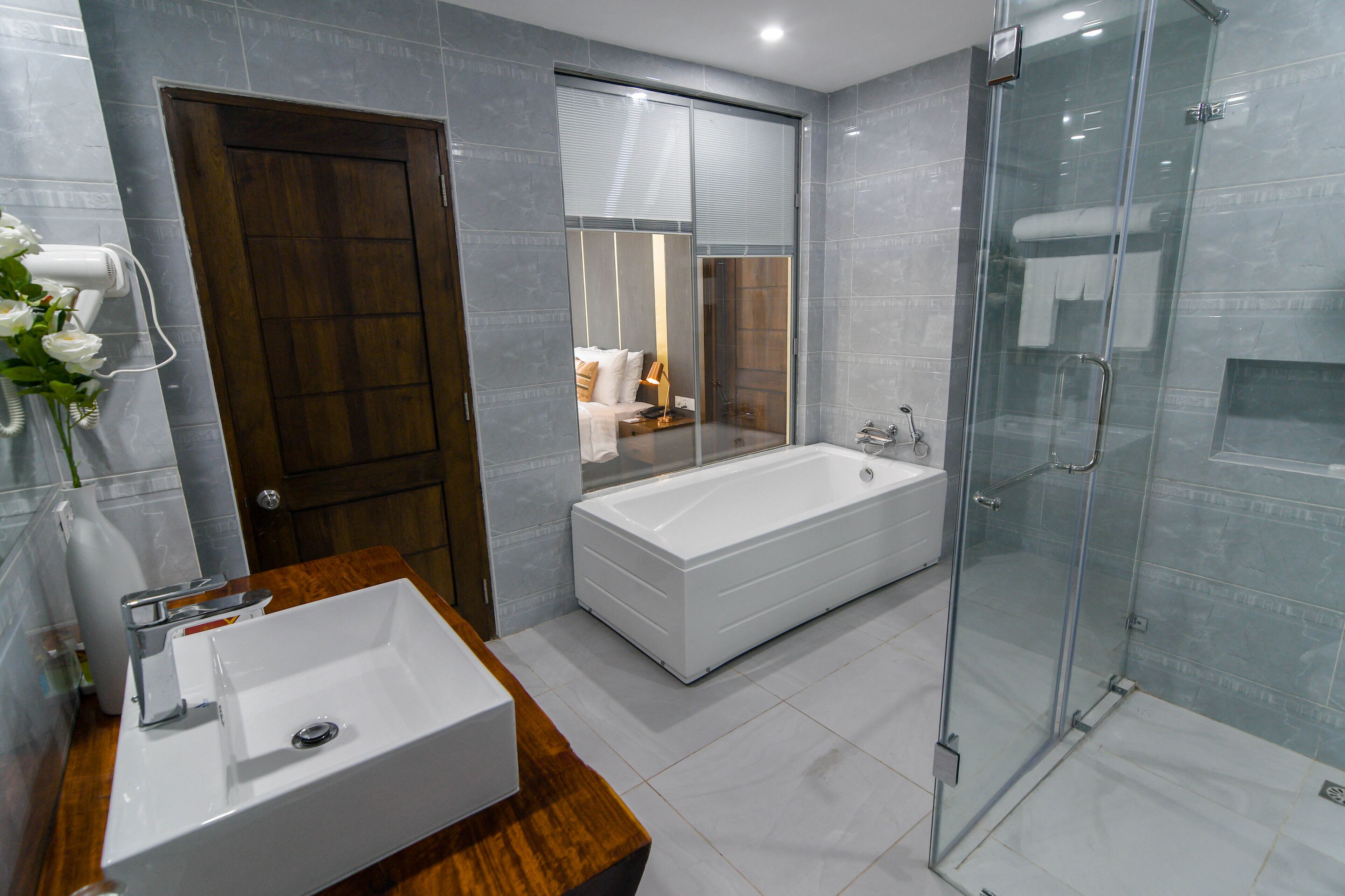 premium suite | bathroom | free toiletries, hair dryer, slippers, towels