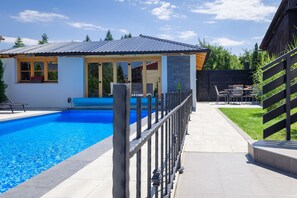 Seasonal outdoor pool, pool umbrellas, pool loungers