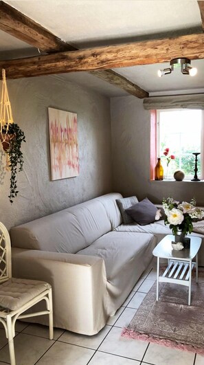 House (Gårdshuset) | Living area | Flat-screen TV - Bäddar & Ängar (Tomelilla)