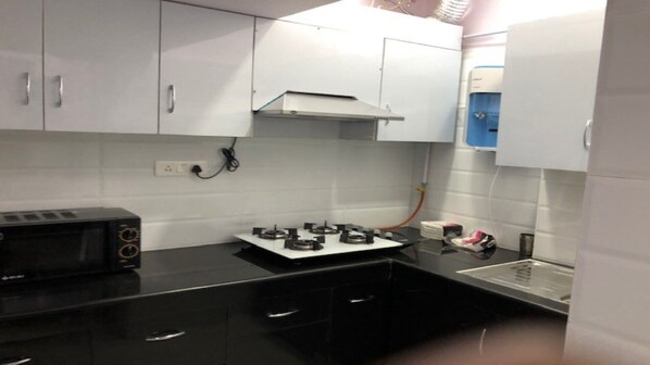 Microwave, coffee/tea maker, cookware/dishes/utensils