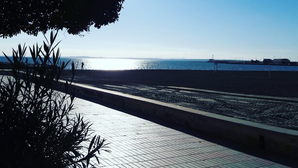 A waterfront promenade with a clear sky and a distant view of the sea. - Apartment for rent 5-6 people, Costa Blanca, Orihuela Costa Spain (Orihuela)