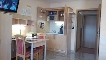 Apartment, Balcony | Private kitchen | Coffee/tea maker