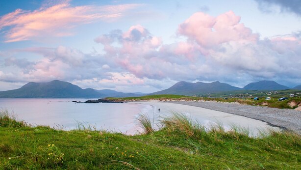 A coastal landscape with a clear sky, grassy foreground, and distant mountains. - Cottage 315 -  Clifden - sleeps 4 guests  in 2 bedrooms (Clifden)