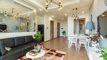 Premium Suite, 2 Bedrooms | Living area | 68-inch Smart TV with cable channels, TV, pay films