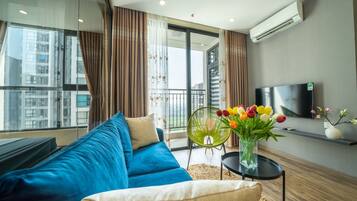 Premium Suite, 2 Bedrooms, 2 Bathrooms | Living area | 68-inch Smart TV with cable channels, TV, pay films