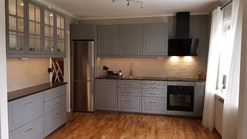 Apartment | Private kitchen | Fridge, coffee/tea maker, electric kettle, dining tables